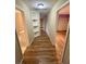 Hallway with wood-looking floors and built-in corner shelves at 1310 Fremont St, Pahrump, NV 89048