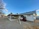 House exterior with covered patio and playset at 1310 Fremont St, Pahrump, NV 89048
