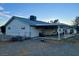 House exterior with covered patio and fenced yard at 1310 Fremont St, Pahrump, NV 89048