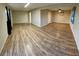 Bright living room featuring light wood laminate flooring at 1310 Fremont St, Pahrump, NV 89048