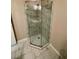 Large walk-in shower with glass enclosure and marble tile at 1310 Fremont St, Pahrump, NV 89048
