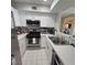 Updated kitchen featuring stainless steel appliances and white cabinetry at 5000 Red Rock St # 116, Las Vegas, NV 89118