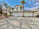 Two-story house with a three-car garage and paved driveway at 9917 Aspen Knoll Ct, Las Vegas, NV 89117