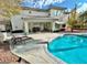 Spacious patio, pool, and outdoor dining area at 9917 Aspen Knoll Ct, Las Vegas, NV 89117