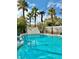 Inviting swimming pool with waterfall feature at 9917 Aspen Knoll Ct, Las Vegas, NV 89117