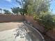 Small backyard with concrete patio and landscaping at 9804 Panorama Cliff Dr, Las Vegas, NV 89134