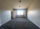 Bright bedroom featuring a large window and closet at 9804 Panorama Cliff Dr, Las Vegas, NV 89134