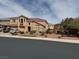 Charming two-story home with a red tile roof, multiple-car garage, and landscaped front yard at 2742 Kingclaven Dr, Henderson, NV 89044