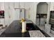 Spacious kitchen with dark countertops, white cabinets, stainless steel appliances, and an island sink at 2742 Kingclaven Dr, Henderson, NV 89044