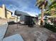 This large backyard has a covered trailer, bar and trees at 7400 Amigo St, Las Vegas, NV 89123