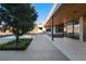 Expansive backyard with a covered patio and a view of the pool and the large sliding glass doors at 6 Rockmount Ct, Henderson, NV 89012