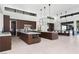 This spacious kitchen features two islands, modern appliances, wood cabinetry, and lots of natural light at 6 Rockmount Ct, Henderson, NV 89012