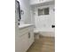 Updated bathroom with white vanity and bathtub at 4313 El Conlon Ave, Las Vegas, NV 89102