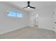 Well-lit bedroom with ceiling fan and access to bathroom at 4313 El Conlon Ave, Las Vegas, NV 89102