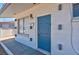 House exterior with blue front door and low maintenance landscaping at 4313 El Conlon Ave, Las Vegas, NV 89102