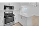 Modern kitchen with white cabinets and quartz countertops at 4313 El Conlon Ave, Las Vegas, NV 89102