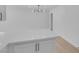 Modern kitchen with white cabinets and a breakfast bar at 4313 El Conlon Ave, Las Vegas, NV 89102