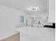 Modern white kitchen with new appliances and quartz countertops at 4313 El Conlon Ave, Las Vegas, NV 89102