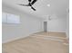 Light and bright living room with wood-look flooring, ceiling fan, and recessed lighting at 4313 El Conlon Ave, Las Vegas, NV 89102