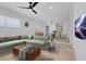 Virtually staged living room with L-shaped sofa and dining area at 4313 El Conlon Ave, Las Vegas, NV 89102