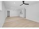 Open concept living room with light flooring and modern lighting at 4313 El Conlon Ave, Las Vegas, NV 89102