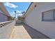 Covered carport area in backyard with concrete paving at 4313 El Conlon Ave, Las Vegas, NV 89102
