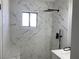 Elegant shower with marble tile and rainfall shower head at 4313 El Conlon Ave, Las Vegas, NV 89102