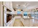 Spacious kitchen with granite countertops, stainless steel appliances, and island at 2731 White Sage Dr, Henderson, NV 89052