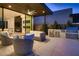 Outdoor patio with built-in grill and seating area at 678 Blackrock Rim Dr, Henderson, NV 89012