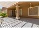View of covered patio with concrete flooring, exterior entry door, and ceiling fans at 1629 Black Fox Canyon Rd, Henderson, NV 89052