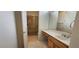 This bathroom includes a vanity with mirror and drawers, a shower with glass door, and easy access to the toilet at 1629 Black Fox Canyon Rd, Henderson, NV 89052