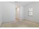 Bedroom with white walls, a window with plantation shutters, and carpet ready for new flooring at 1629 Black Fox Canyon Rd, Henderson, NV 89052