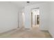 Bedroom with white walls, carpet ready for new flooring, and a double door closet at 1629 Black Fox Canyon Rd, Henderson, NV 89052