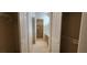 Walk through closet leads to an ensuite bathroom with easy accessibility for clothing and personal care routines at 1629 Black Fox Canyon Rd, Henderson, NV 89052