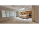 Open concept living and kitchen area with a center island, tile flooring, and plenty of cabinet space at 1629 Black Fox Canyon Rd, Henderson, NV 89052