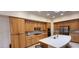 Spacious kitchen boasts oak cabinets, tile backsplash and stainless steel appliances at 1629 Black Fox Canyon Rd, Henderson, NV 89052