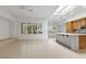 Open concept kitchen featuring tile floors, stainless steel appliances, kitchen island, and plenty of cabinet space at 1629 Black Fox Canyon Rd, Henderson, NV 89052