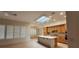 Bright kitchen shows a large island, oak cabinets, tile floor and eat in area at 1629 Black Fox Canyon Rd, Henderson, NV 89052