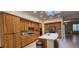 Bright kitchen features a center island, oak cabinets, and stainless steel appliances at 1629 Black Fox Canyon Rd, Henderson, NV 89052