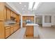 Gourmet kitchen with stainless steel appliances, an island, and lots of wood cabinet storage at 1629 Black Fox Canyon Rd, Henderson, NV 89052