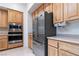 Kitchen featuring stainless steel appliances and wood cabinets at 1629 Black Fox Canyon Rd, Henderson, NV 89052
