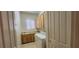 Functional laundry room equipped with cabinetry, sink, and modern appliances at 1629 Black Fox Canyon Rd, Henderson, NV 89052