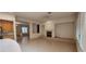 Spacious living area with tile floors flows into kitchen with a center island at 1629 Black Fox Canyon Rd, Henderson, NV 89052