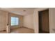 This open living space includes tile floors, a neutral color palette, and natural light for a cozy atmosphere at 1629 Black Fox Canyon Rd, Henderson, NV 89052