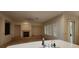 The living room includes a cozy fireplace, ample natural light, and convenient access to the kitchen and outdoor areas at 1629 Black Fox Canyon Rd, Henderson, NV 89052