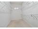 Empty walk-in closet featuring wire shelving and minimal natural light at 1629 Black Fox Canyon Rd, Henderson, NV 89052