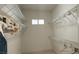 Spacious walk-in closet with wire shelving and a small window for natural light at 1629 Black Fox Canyon Rd, Henderson, NV 89052