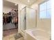This bathroom features a tub and shower, along with a spacious walk-in closet at 3716 W Colton Ave, North Las Vegas, NV 89032