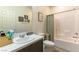 Bright bathroom with shower-tub combo, clean white fixtures, and stylish vanity at 3716 W Colton Ave, North Las Vegas, NV 89032