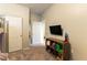 Neutral bedroom with a closet and an entertainment center with a television set at 3716 W Colton Ave, North Las Vegas, NV 89032
